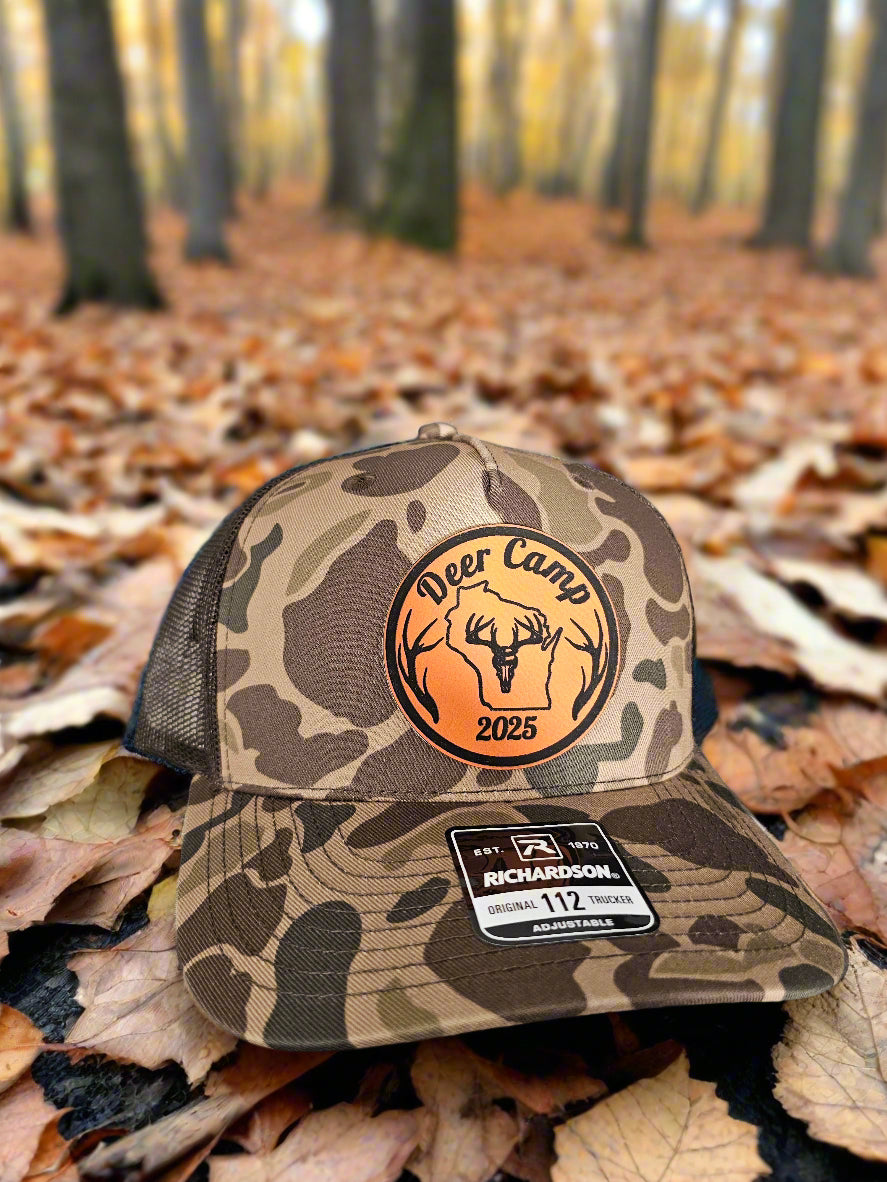 Camouflage hunting glove with logo and brand label on a textured surface