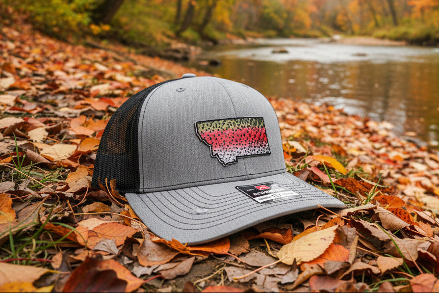 Gray cap with a colorful logo on a wooden floor