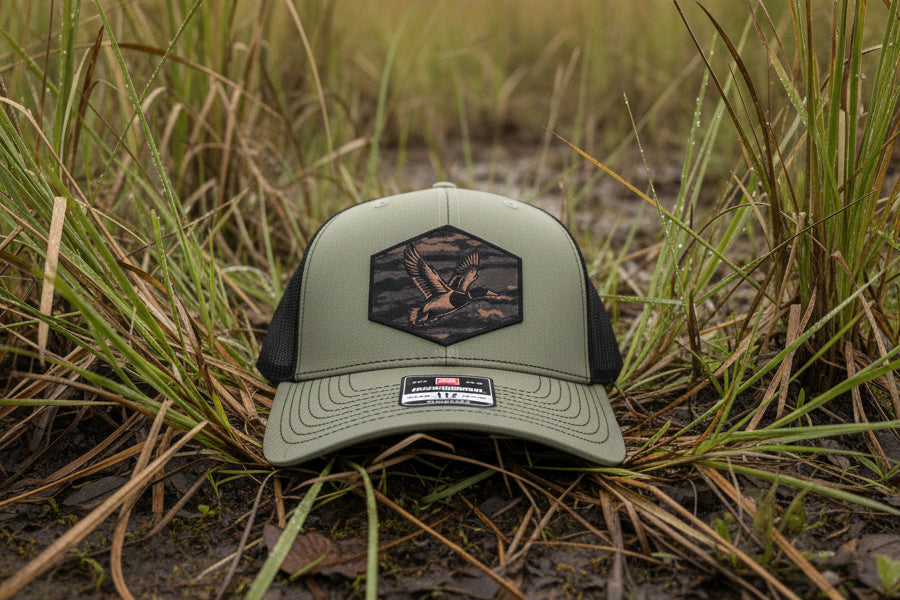 Green cap with a logo on a textured surface