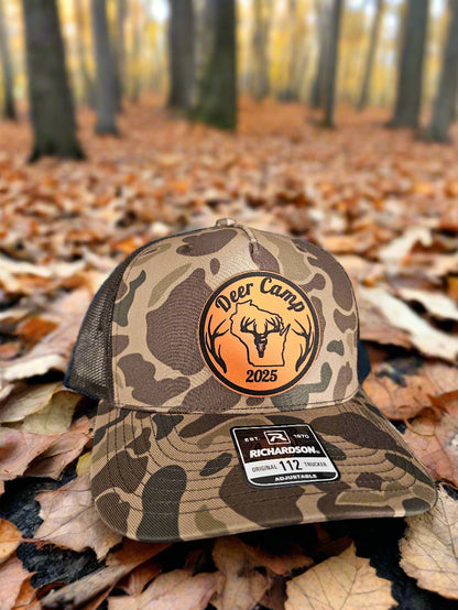 Camouflage hunting glove with logo and brand label on a textured surface