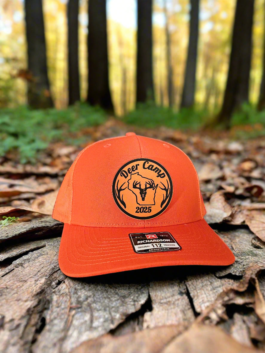 Orange cap with a logo on a textured surface