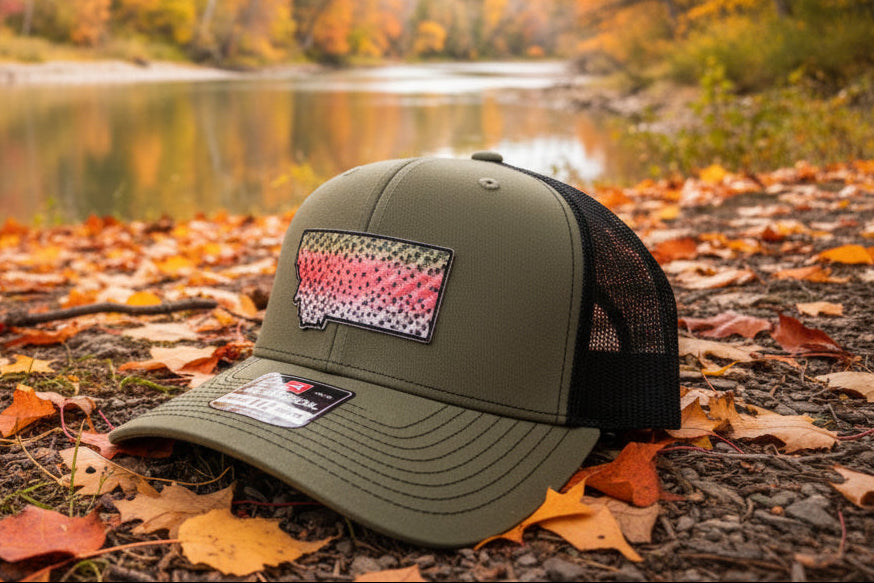 Green cap with a logo on a gray floor